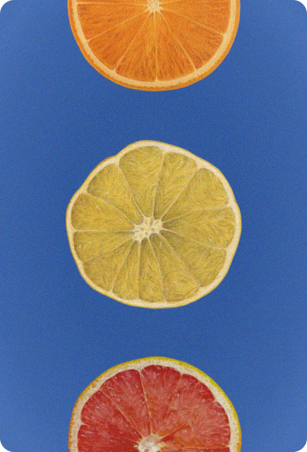 Orange, lime, and grapefruit slices on a blue background representing fresh citrus for NA drinks with Wims.