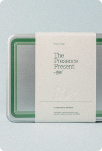 Wims “The Presence Present” holiday countdown calendar shown in a metal tin with green detailing and a minimalist cream wraparound label featuring the product name and description.