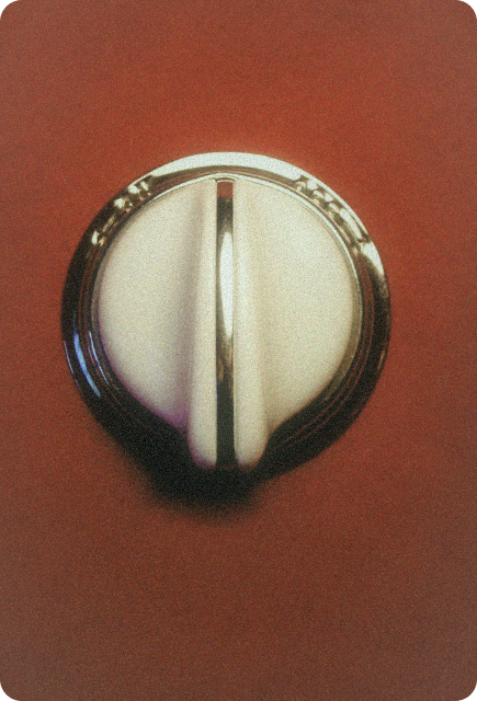 Minimal silver dial on a warm-toned background, representing finding the right Wims dose for a social gathering.