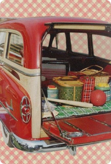 Vintage station wagon packed with picnic essentials, including baskets, blankets, coolers, and outdoor games.