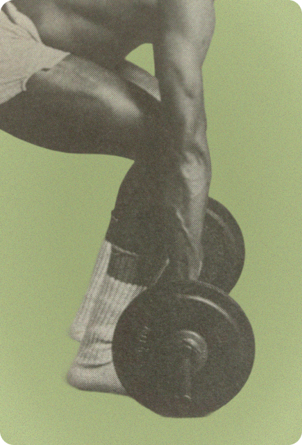 Close-up of a person lifting a dumbbell during strength training, representing focused and intentional movement.