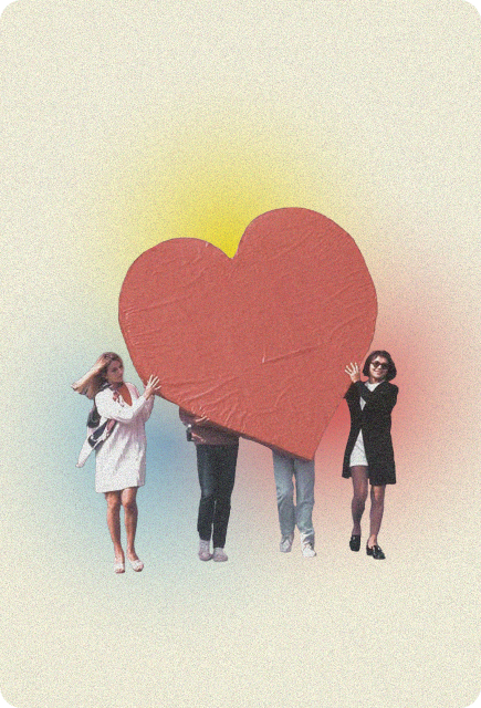 Group of people carrying a giant red heart together, representing connection, joy, and the shared feel-good experience of Wims.