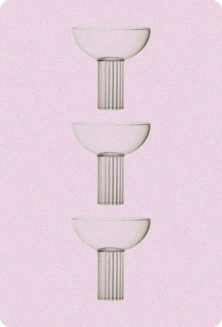Three coupe cocktail glasses stacked vertically against a soft pink textured background, symbolizing featured community mixology recipes for Wims.