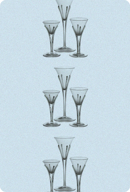 Set of elegant martini glasses arranged on a light background, representing versatile glassware for Wims mixology.