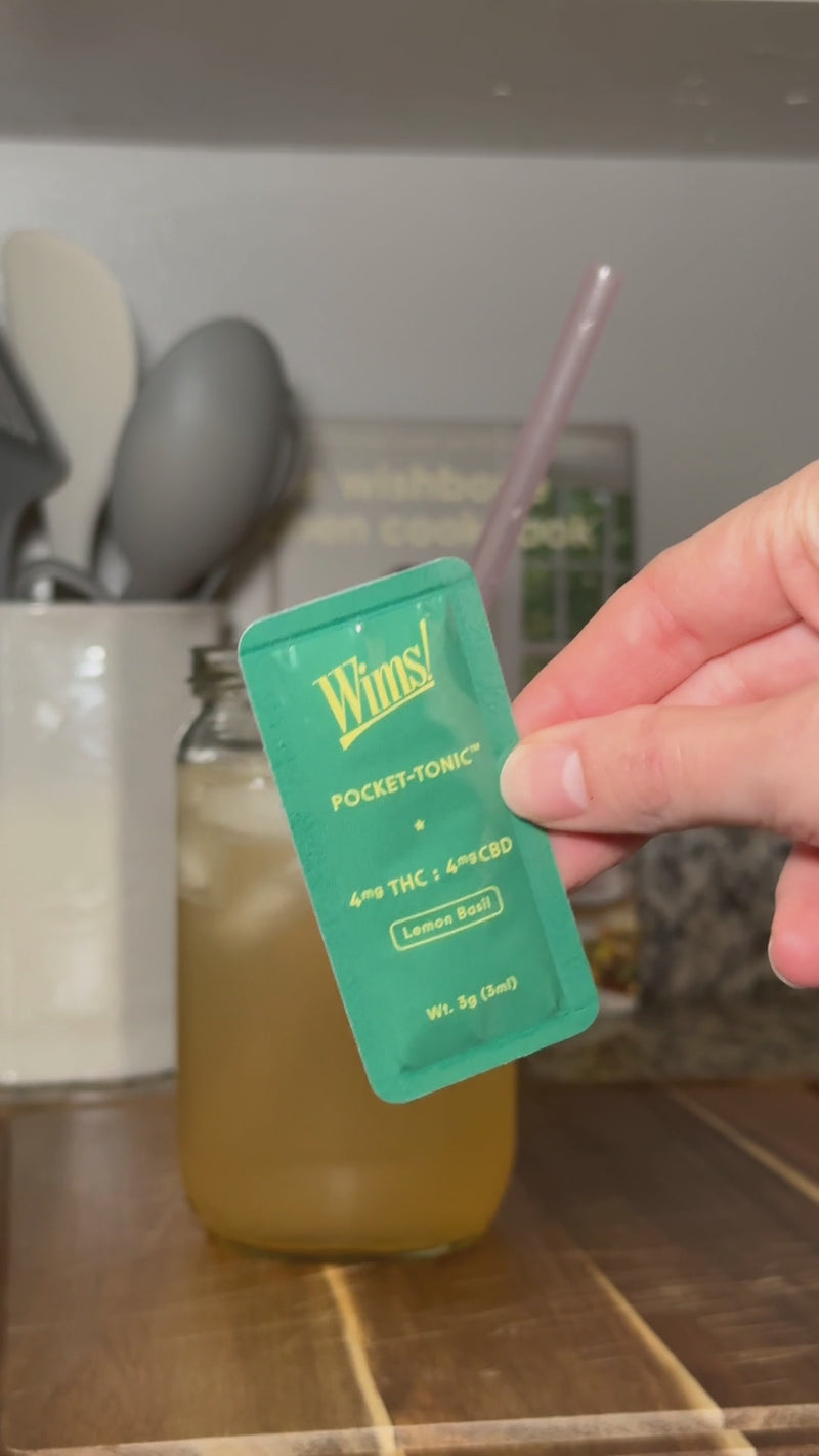 Lemon Basil Wims Pocket-Tonic™ being snapped into the Citrus Grove Spritz and stirred until fully incorporated.