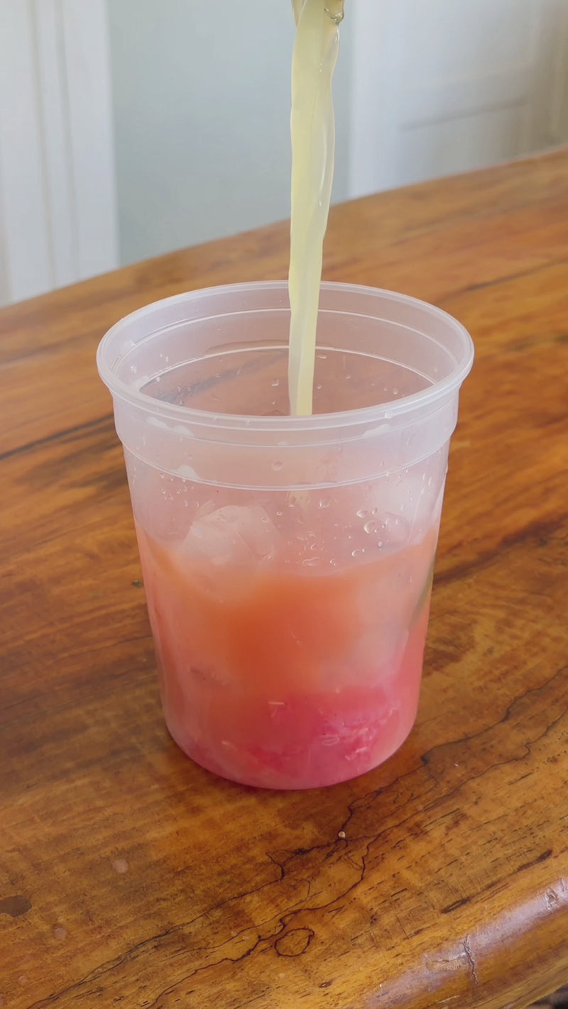 Lime juice, agave, and sea salt added to the citrus mixture as the container is closed and shaken to combine.