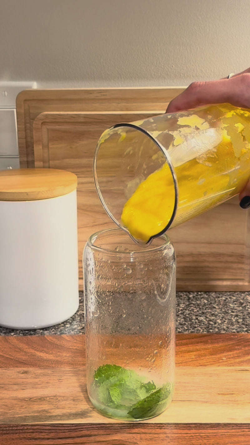Mango purée stirred with lime and mint, then topped with ice and sparkling water.